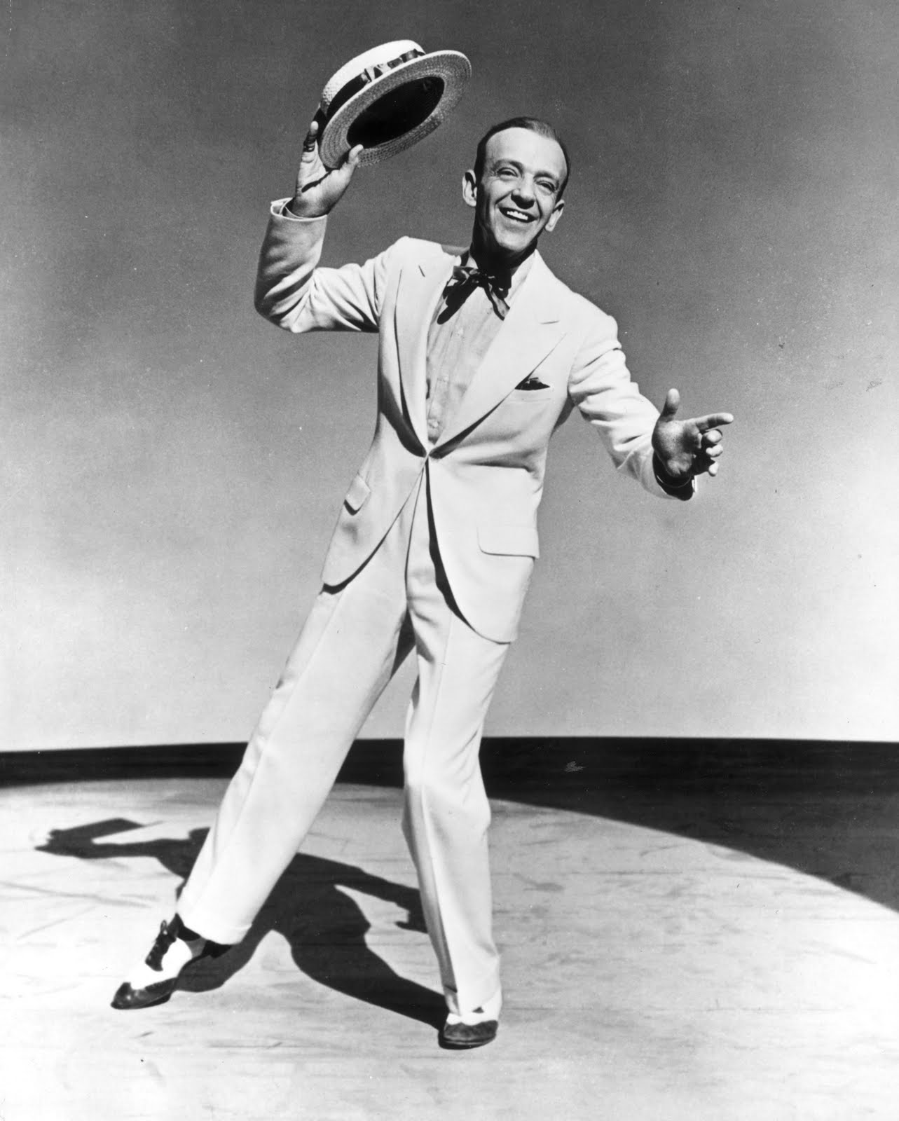 These three images show perhaps the best dreseed slight man ever, Fred Astaire, do everything right.